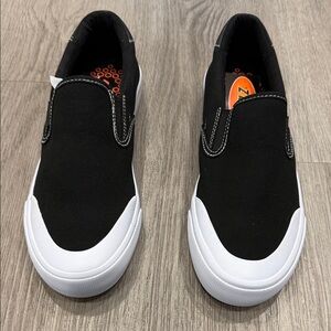 LUGZ Black and White Slip-On Sneakers